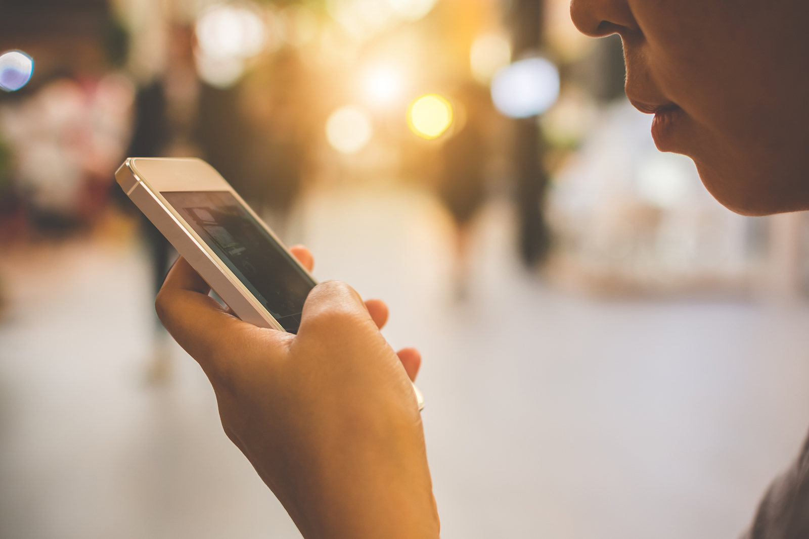 Asian woman hand holding mobile phone and using application on smartphone