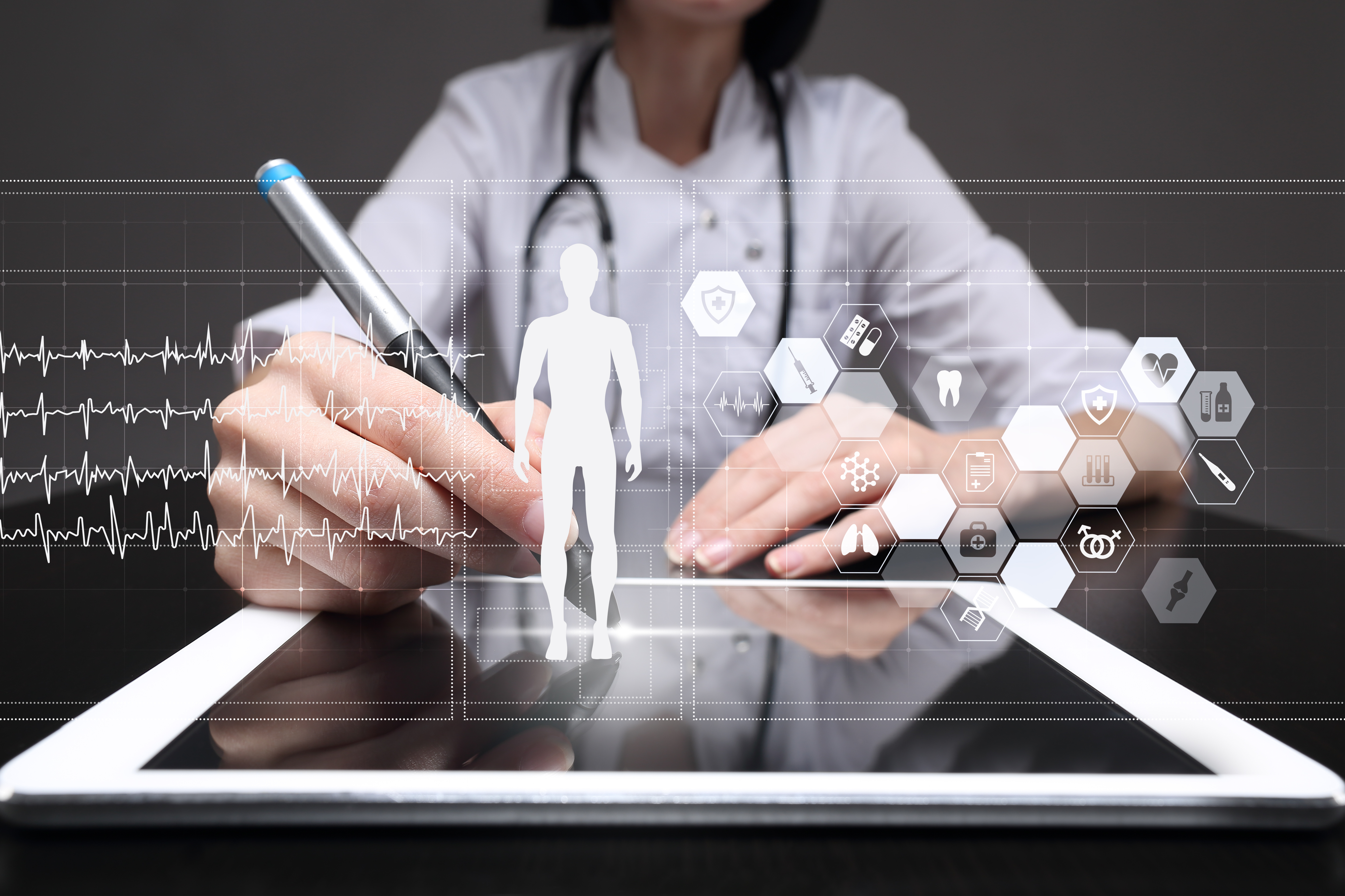 Doctor using modern computer with Medical record diagram on virtual screen concept. Health monitoring application.